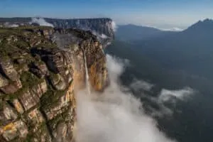 Canaima | Antonio | Aerial shot of a waterfall down a mountainside